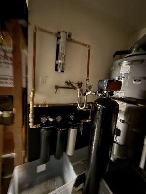 Whole house water filtration and water softner system.