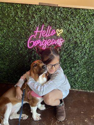 They have this really cute grass like wall so we had meadow and her big sister take a picture together