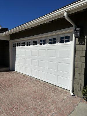 White sectional garage door with widows