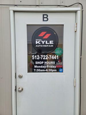 Front door showing phone number and hours of operation.