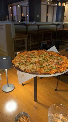 Tomato and cheese pizza with jalapeño