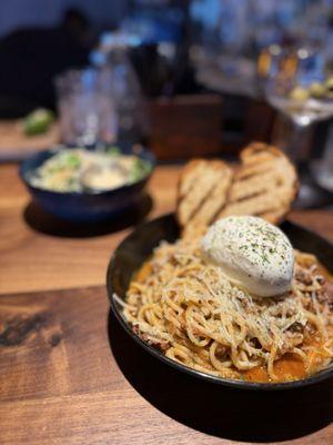 The bolognese with burrata and side Caesar salad