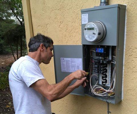 Kirk, Buckman wiring up a new 200-amp home panel.