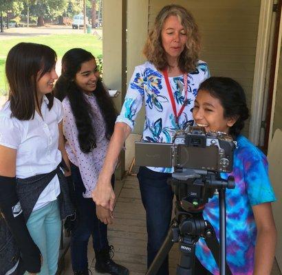 Erica and students filming at Media Poetry Studio's summer camp.