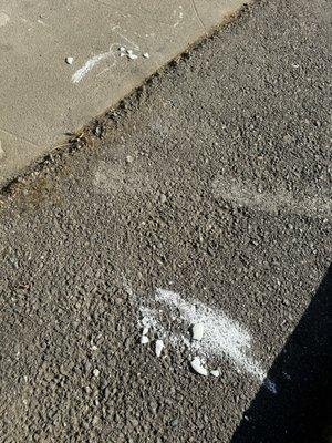 Unknown substance on the floor in front of our door on the path, maybe broken soap bars