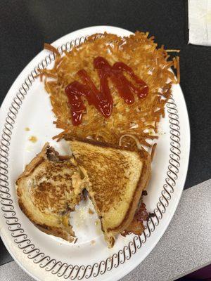 Texas bacon patty melt and hash browns.