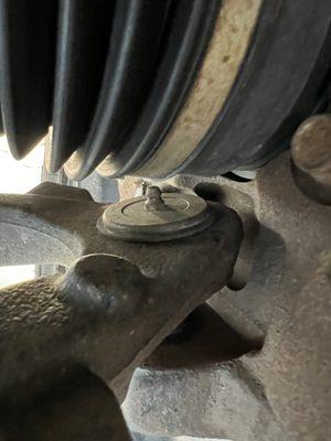 Lower ball joint with incorrect zerk fitting (should be 90 degrees)