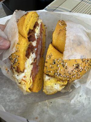 bacon & egg on Everything bagel with onion and tomato