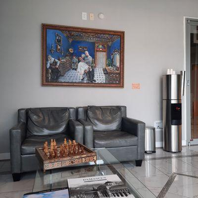 Lobby with Syrian artwork, water station