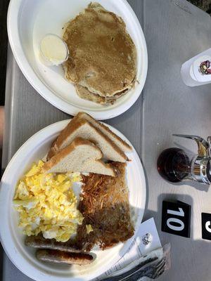 Scrambled egg harsh brown sausage and pancakes