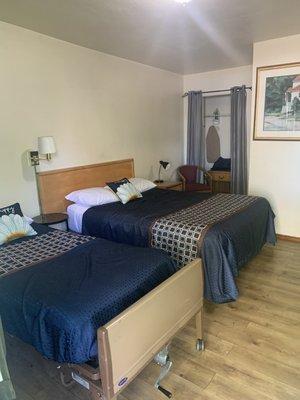 View from the door. A Queen and twin bed.