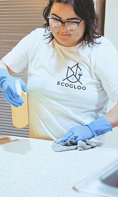 Julia wiping down the counters - every clean starts with the little things that make a big difference.