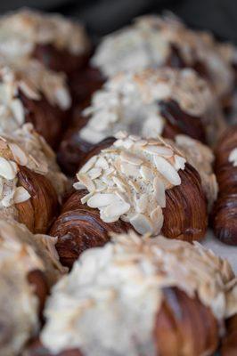 Almond Croissant - Isigny Butter Croissant filled with Housemade Almond Creamy Filling made with almond flour. Topped with slivered almonds.