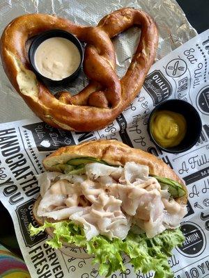 Turkey sandwich with everything and a jalapeño cheddar pretzel + cheese sauce! So yummy (IG: @mylifeaskat_)