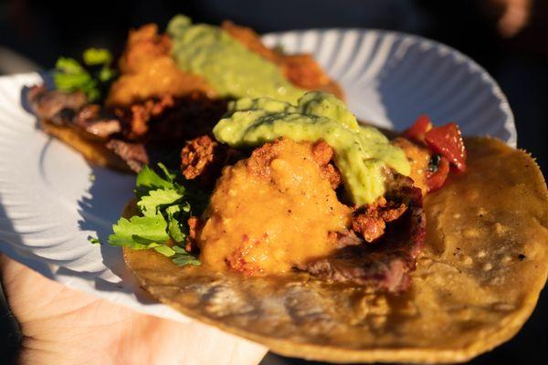 Cecina taco with longaniza on top and the works with sauces