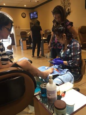 She stopped the pedicure to spend 5 minutes dialing a phone number and gossiping with the other workers. We are not coming back here.