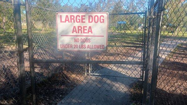 Entry to the large dog area with a double gated concrete entry area