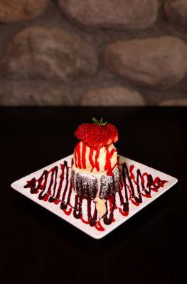 Molten Lava Chocolate Cake: Completely gluten-free. Served warm with a scoop of vanilla ice cream and strawberry drizzle