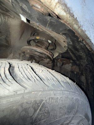 Clean cut around the shock to get rid of the broken plastic.