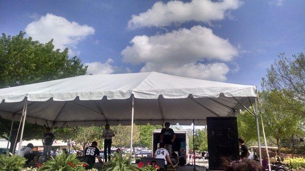 Performers kneeling as they perform the Philippine folk dance.