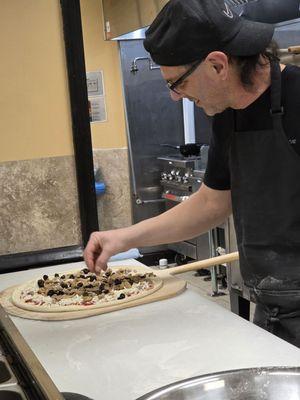 Close-up of the making of an Italian culinary masterpiece.