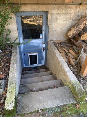 Before photo of basement door without railing.