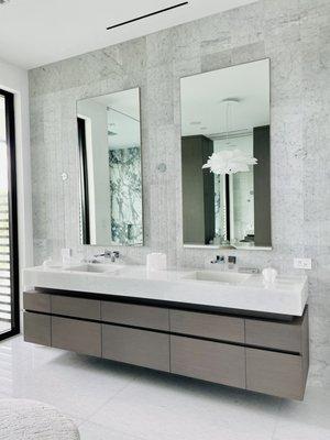 Savocchi supplies and installs custom wall mirrors, and shower enclosures.