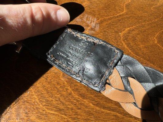 Wrong color thread, belt stitched in wrong place, over glued.