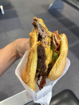 Single burger with bacon and avocado