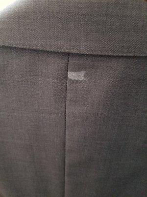 This spot was on my suit when I picked it up, and the person at the counter denied responsibility. She said, "It's not my problem."