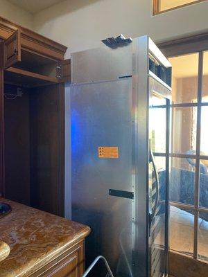 Refrigerator waiting another 10 days to complete repairs.