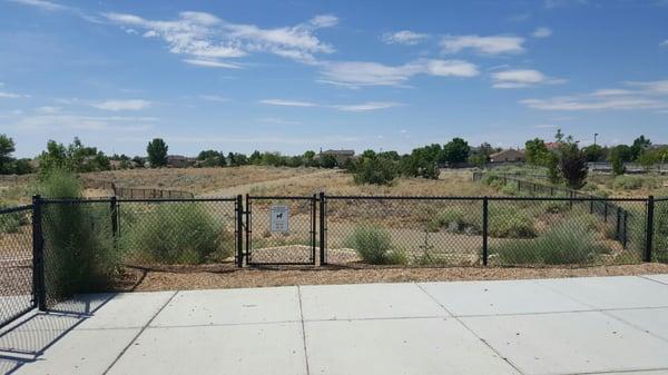 As seen from N staging area, walking path with some of the big dog side visible on L, and most of the small dog side on R.