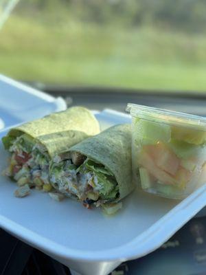 Spicy bacon chicken ranch wrap with fruit.