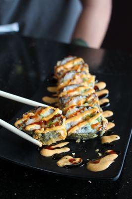 Godzilla Roll
-Salmon, Avocado and Cream Cheese, deep fried and topped with Spicy Mayo and Eel Sauce