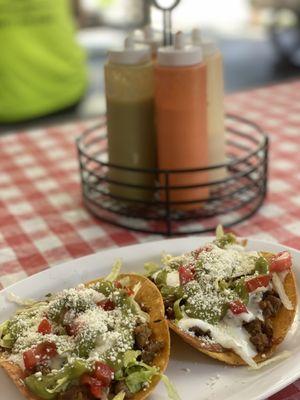 Tostadas and sauce brought to the table