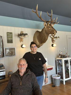 Warren, barber Rebecca, and Mongolian Elk watching over the shop.