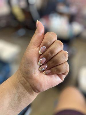 French tip in yellow, almond shape with floral details.