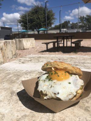 Buttermilk biscuit, pork fennel sausage, fresno pimento cheese, fried egg and honey mustard pickles