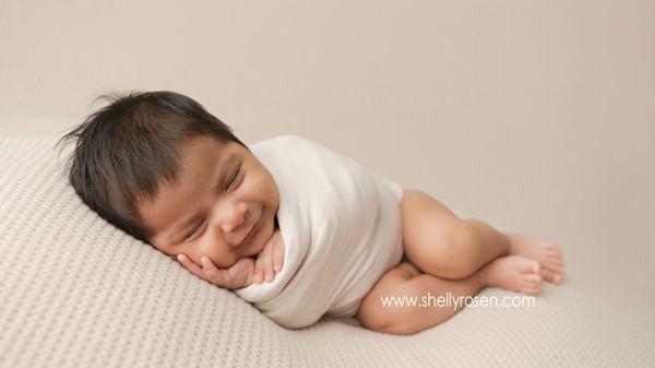 Happy baby! Dreaming about Mom I think.