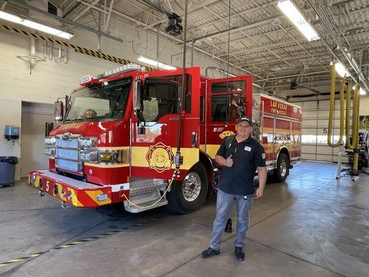 Roman working on a main fridge not cooling due to defective evaporator fan motors assembly.