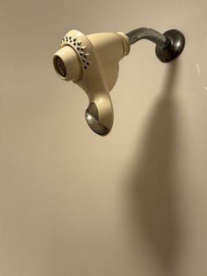 Old shower that sprays water in a rotating circle on high pressure only