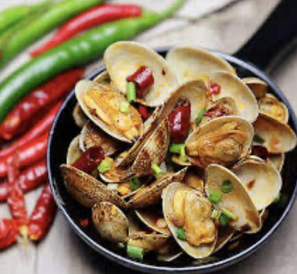 Spicy Clams with Mala Sauce - Fresh clams stir-fried in a bold and numbing Sichuan-style mala sauce.