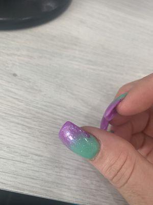 Sloppy thick uneven rushed and totally mid shaped she did not even fully cover my nail with top coat !!