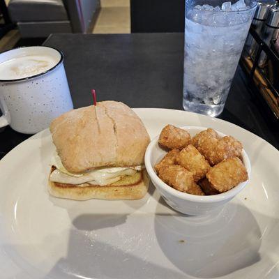 Avacodo egg sandwich and tots