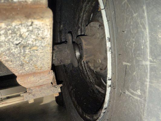 Axle broken. Bearings sheered off. Axle just resting in the hub and could just pull the tire straight off