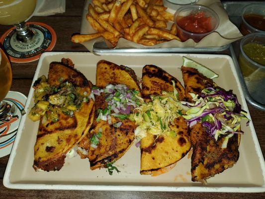 Al pastor, birria, kimchi and chile verde taco