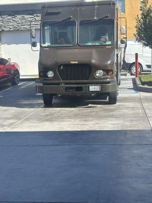 UPS PARKED IN HANDICAP. Good luck to those who really need the parking space.