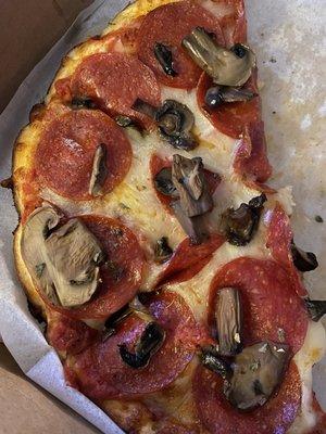 Small thin crust with pepperoni and mushrooms.