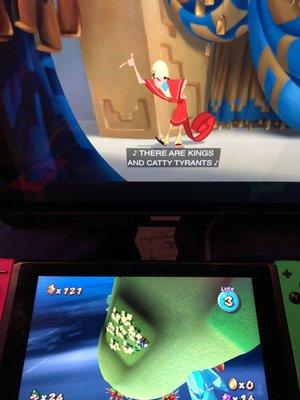 Recharging my phone while playing Mario on my Nintendo Switch, and watching Emperor's New Groove on my iPad lol