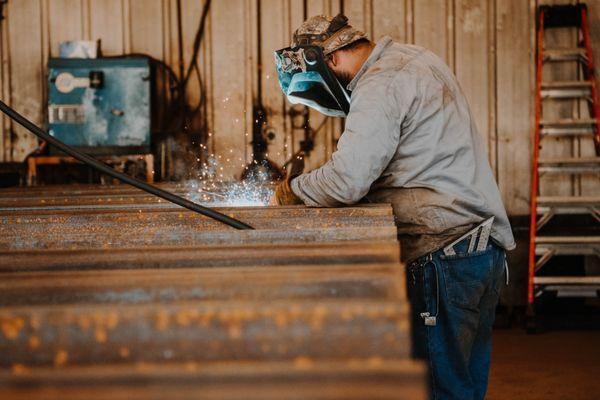 Diamond T welder crafting a trailer in our production shop.